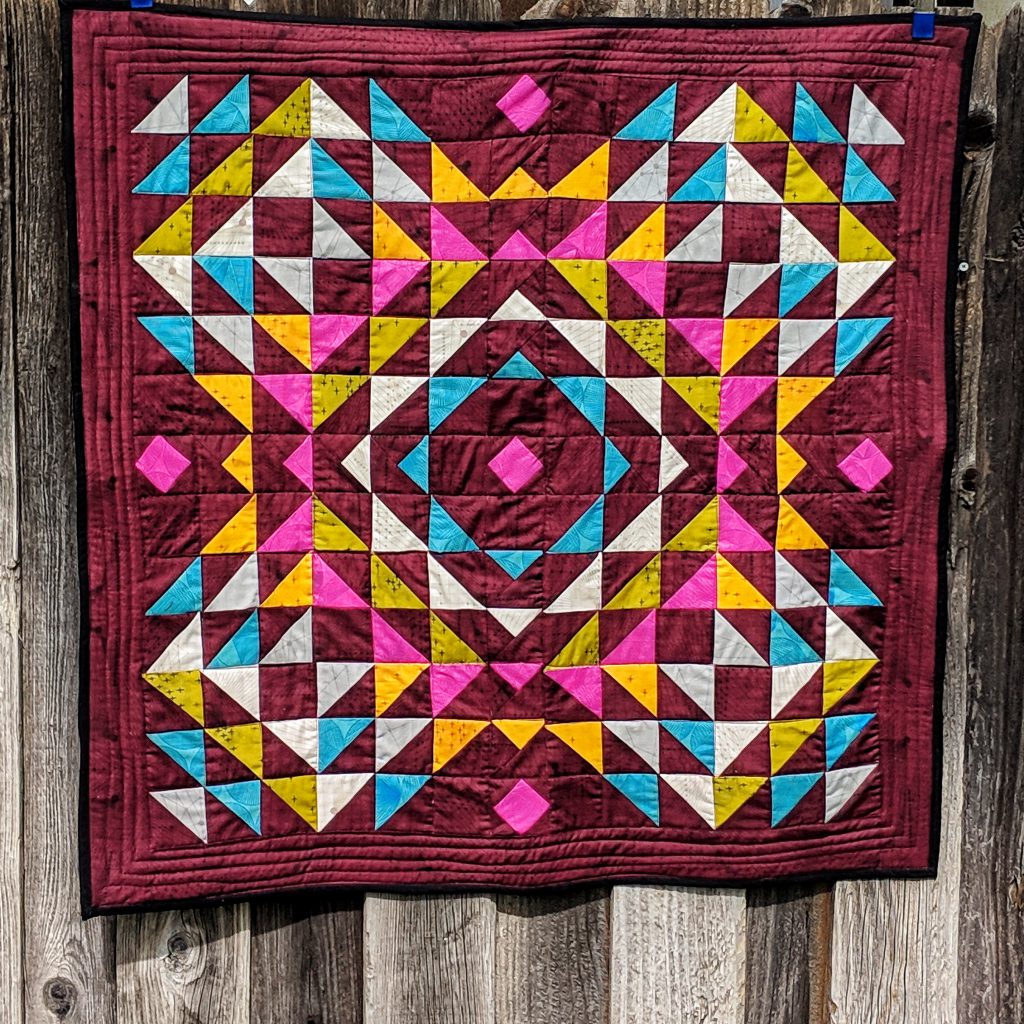 Totality Quilt Pattern featuring Quantum by Giucy_Giuce . I adore how these half square triangles are laid out #quilts #patchworkquilts #modernquilts